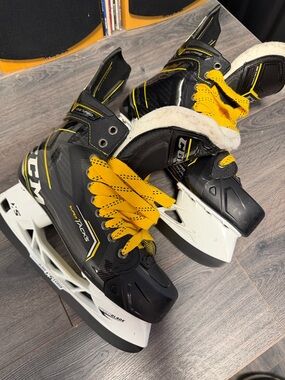CCM Black Hockey Skates with Yellow Laces